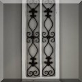 D08. One of a pair of metal and wood wall décor pieces. 